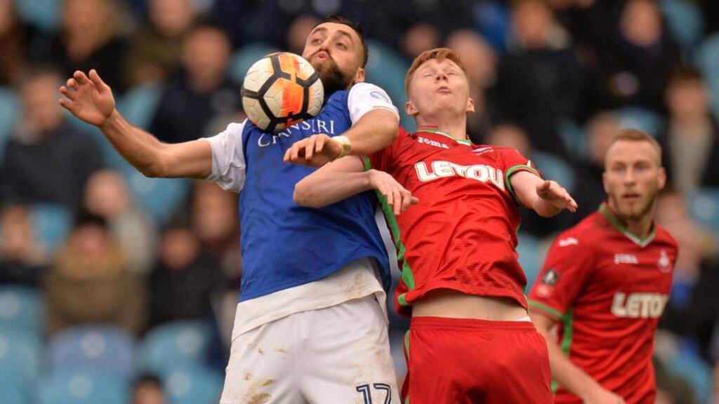 Sheffield Wednesday’s Atdhe Nuhiu in action with Swansea City’s Samuel Clucas during their FA Cup clash. Photo: Peter Powell/Reuters