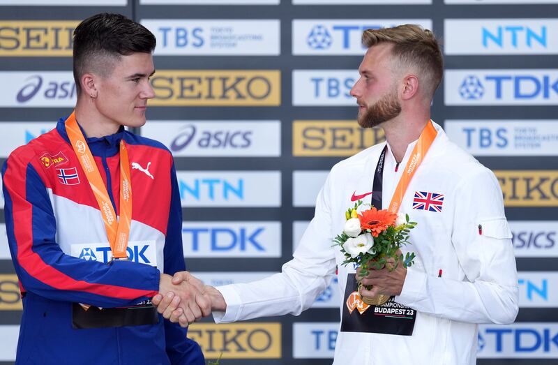 Great Britain's gold medalist Josh Kerr shakes hands with silver medalist Norway’s Jakob Ingebrigtsen during the medal ceremony for the Men's 1500 Metres on day seven of the World Athletics Championships at the National Athletics Centre in Budapest, Hungary. Photograph: Martin Rickett/PA Wire
