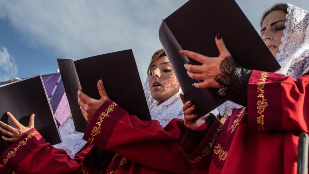 Choristers sing during a canonisation ceremony for victims of the Armenian genocide at the Mother See of Holy Etchmiadzin, a complex that serves as the administrative headquarters of the Armenian Apostolic Church, in Vagharshapat yesterday. Photograph: Brendan Hoffman/Getty Images