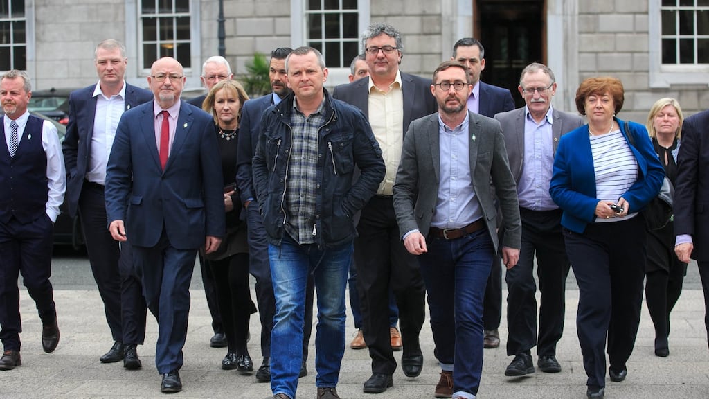 Sinn Féin TD Eoin O’ Broin (centre right) with Richard Boyd Barrett TD, (centre left) and other Right 2 Water TD’s and parties during a press conference reacting to the final draft report of the Joint Committee on the Future Funding of Domestic Water Services at Leinster House on Thursday. Photograph: Gareth Chaney/Collins