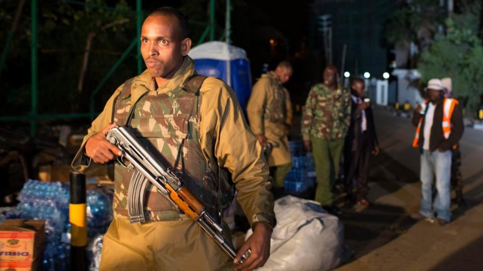 A police officer walks towards the edge of a security perimeter put into place a distance from the Westgate Shopping Centre in Nairobi, in the early hours of the morning. Photograph: Reuters