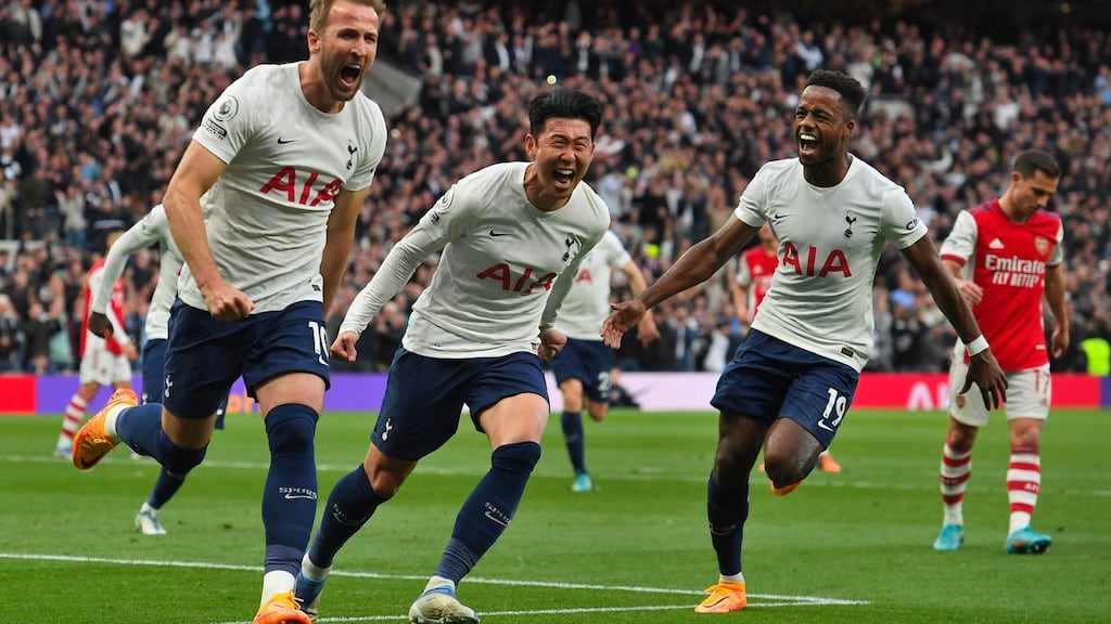 Harry Kane celebrates his first goal against Arsenal with Son Heung-min and Ryan Sessegnon. Photograph: EPA