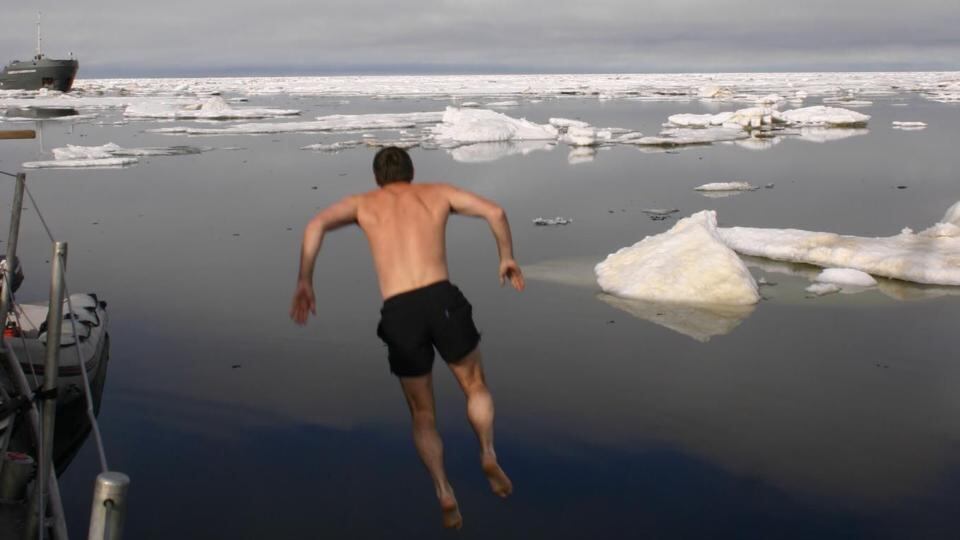 Northabout crew member Rory Casey plunges into the Arctic in 2004 as the first Irish boat to navigate the Northwest Passage attempted to navigate the Northeast Passage in 2004