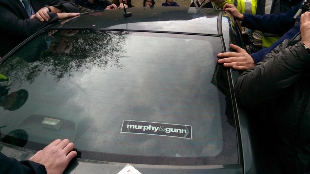 A car carrying Tanaiste Joan Burton is seen surrounded by water charge protesters in Tallaght. Photograph: Paul Murphy via Twitter