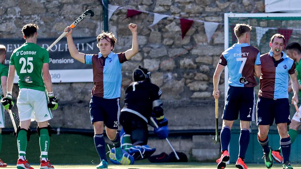 Three Rock Rovers players celebrate after their captain Jody Hosking fired home the winner with just 48 seconds from time . Photograph: Laszlo Geczo/Inpho