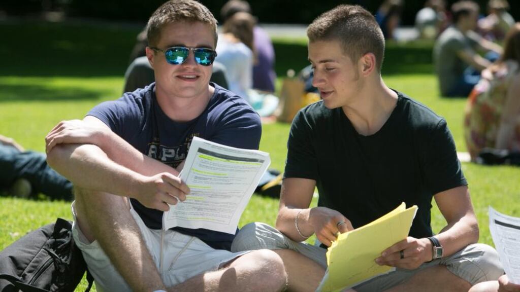 Institute of Education Leaving Cert students Neill Rafter (left) and Josh McKell enjoying the sunshine in St Stephen’s Green, Dublin, yesterday following exams. Photograph: Gareth Chaney/Collins