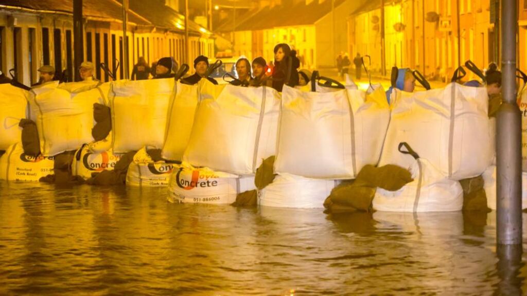 Residents behind sandbags at Poleberry, Waterford city. Photograph: Patrick Browne
