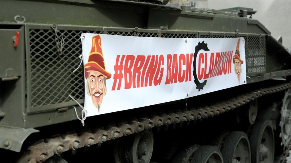 A man dressed as Top Gear’s ‘The Stig’ delivers a million signature petition by tank to the BBC offices. Photograph: PA