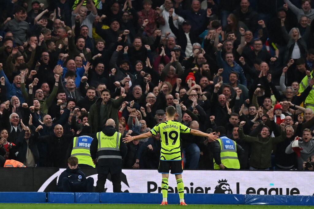 Leandro Trossard celebrates after scoring Arsenal's third goal during the Premier League match against Brighton at the Amex Stadium. Photograph: Glyn Kirk/AFP via Getty Images