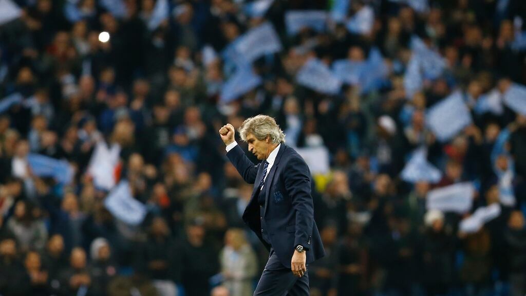 Manchester City manager Manuel Pellegrini celebrates after the game. Photograph: Darren Staples/Reuters