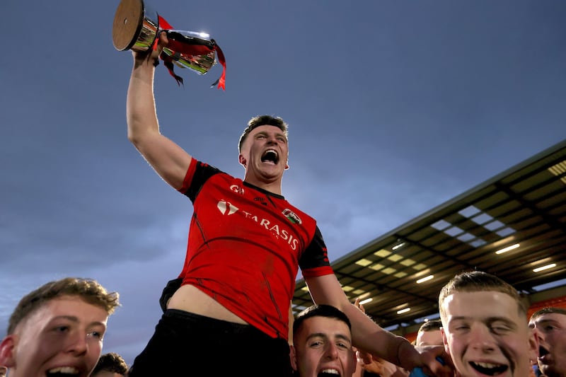 Madden's Oisin O'Hara celebrates with the Gerry Fagan Cup. Photograph: Leah Scholes/Inpho