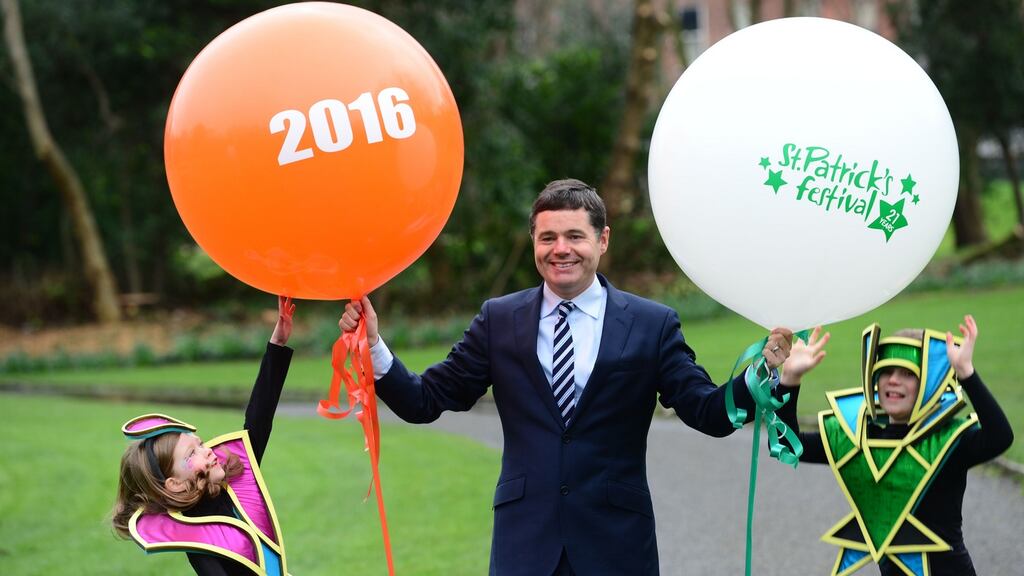 Minister for Transport, Tourism and Sport, Paschal Donohoe at the launch of the St Patrick’s Festival 2016 with festival parade characters, Ciara Withington (6) and James MacDougald (8) in Merrion Sq, Dublin.Photograph: Dara Mac Dónaill/The Irish Times