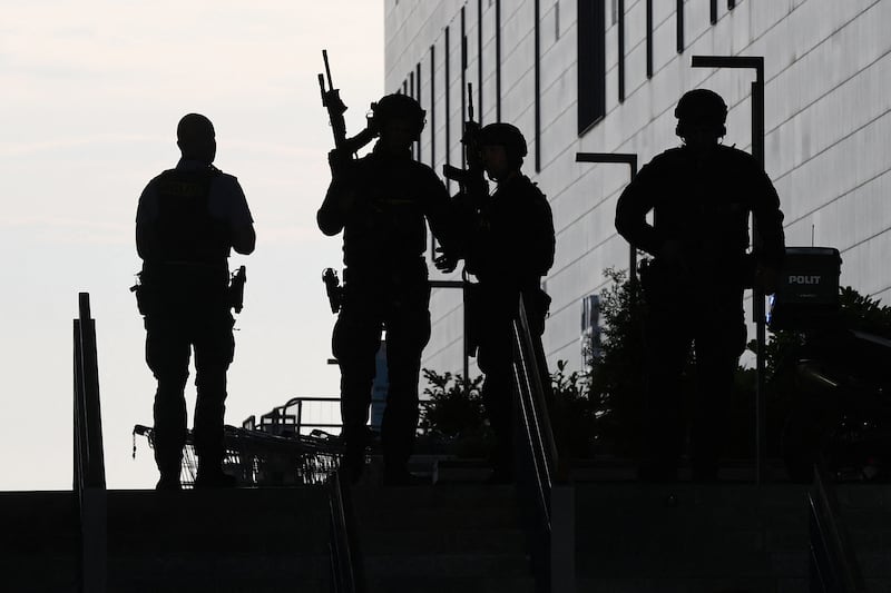 Armed police work at the scene of the Field's shopping centre in Copenhagen