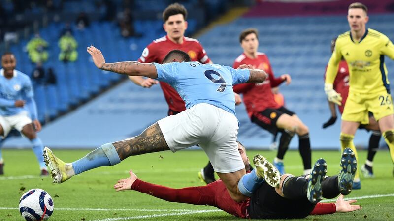 Shaw tackles Gabriel Jesus. Photo: Peter Powell/EPA