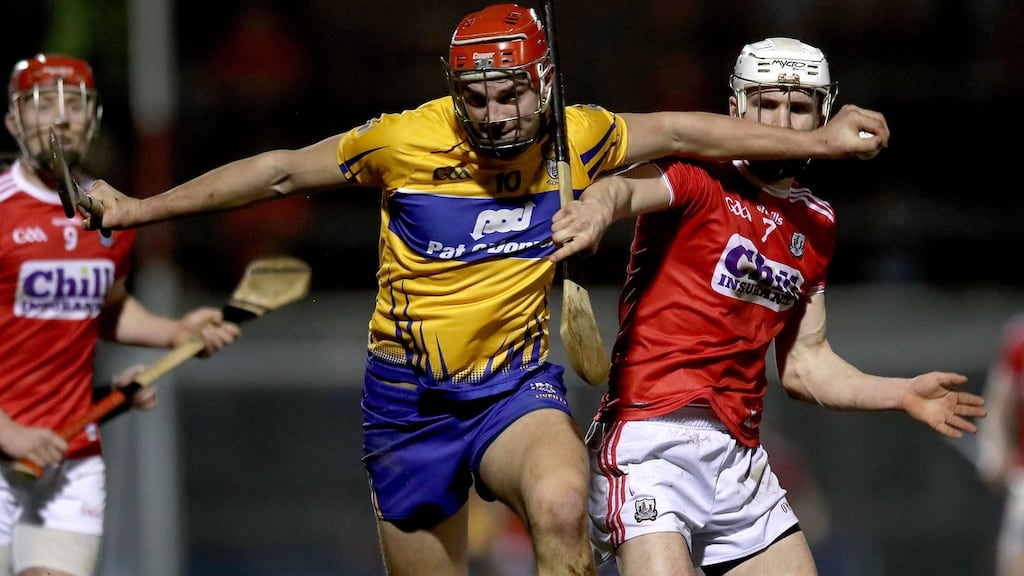 Clare’s Peter Duggan tries to shake off the challenge of Cork’s  David Griffin during the Allianz Hurling League Division 1A match  at Páirc Uí Rinn. Photograph: Bryan Keane/Inpho