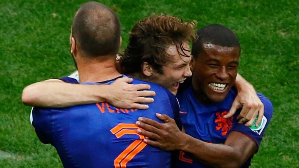 Daley Blind of the Netherlands celebrates his goal against Brazil with teammates Ron Vlaar (left) and Georginio Wijnaldum at the Brasilia National Stadium. Photograph: Ruben Sprich / Reuters