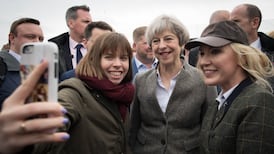 May urges parties to ‘come together’ during Northern Ireland visit