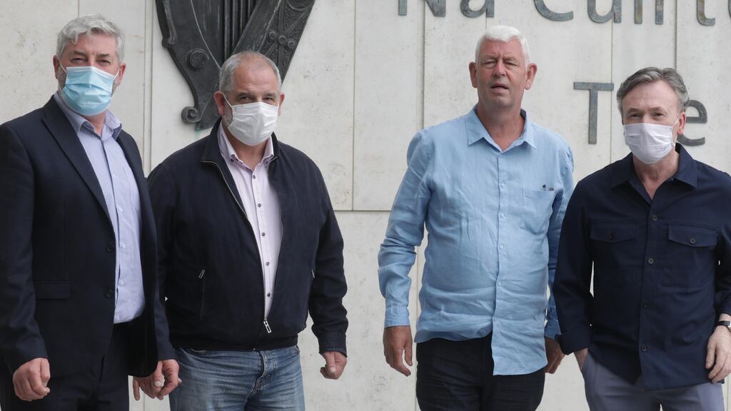 Just boys then but men now: Thomas O’ Callaghan, Kieran Best, Daniel Lynch and Anthony Doherty leaving the Criminal Courts of Justice after the sentence hearing of their abuser, Jack Manning. Photograph: Collins Courts