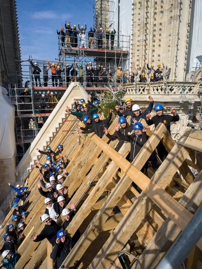 Notre-Dame: carpenters and other craftspeople on March 8th, 2024, after completing the new timber framework above the nave. Photograph: David Bordes/Rebâtir Notre-Dame de Paris