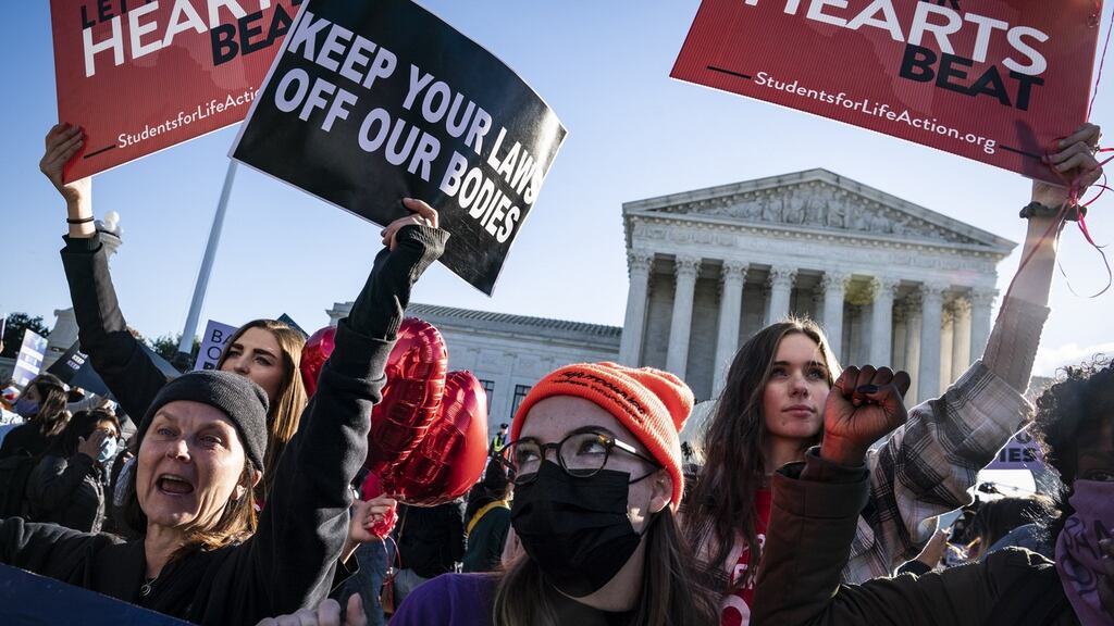 Protesters gather outside the supreme court as arguments begin about the Texas abortion law on Capitol Hill in Washington. Photograph: Jabin Botsford/ The Washington Post via Getty