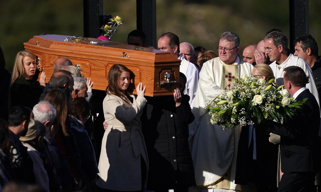 The coffin of Hugh Kelly is carried from St Michael's Church, in Creeslough following his Funeral Mass. Photograph: Brian Lawless/PA