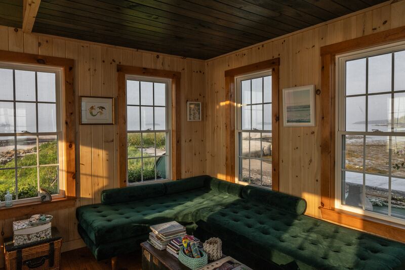 With its simple décor and windows on all sides looking out on the water, the interior has the coziness of a ship’s cabin. Photograph: Greta Rybus/The New York Times