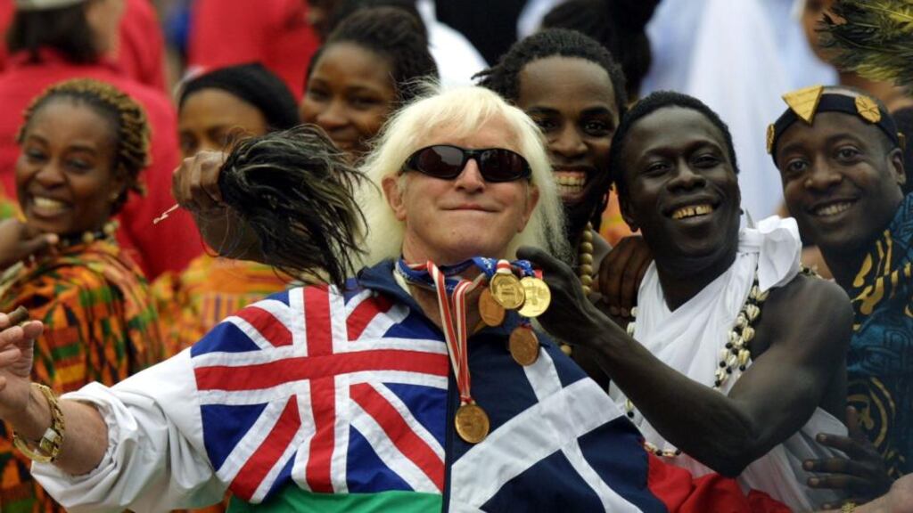 Jimmy Savile celebrity awed some, while his bullying, dominant personality frightened others. His fund-raising skills were seen as useful by Margaret Thatcher’s government, particularly, who “feted” Savile. Photograph: Adrian Dennis/AFP/Getty Images