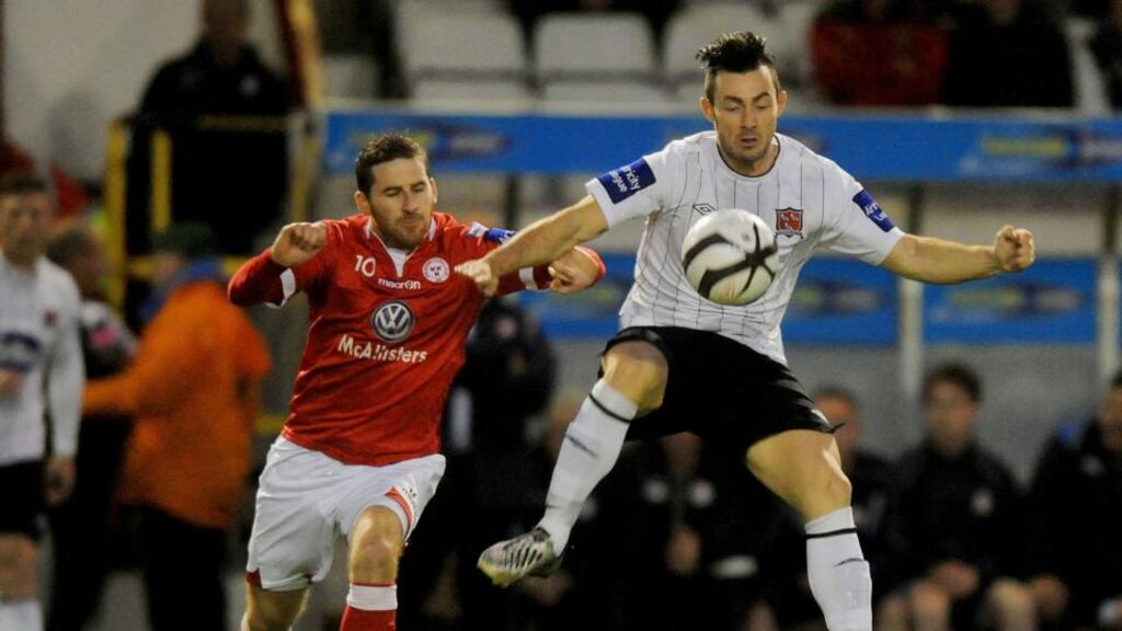 Dundalk goalscorer Richie Towell battles with Shelbourne’s Dean Kelly during their FAI Cup quarter-final at Tolka Park, Dublin, last night. Photograph: Inpho