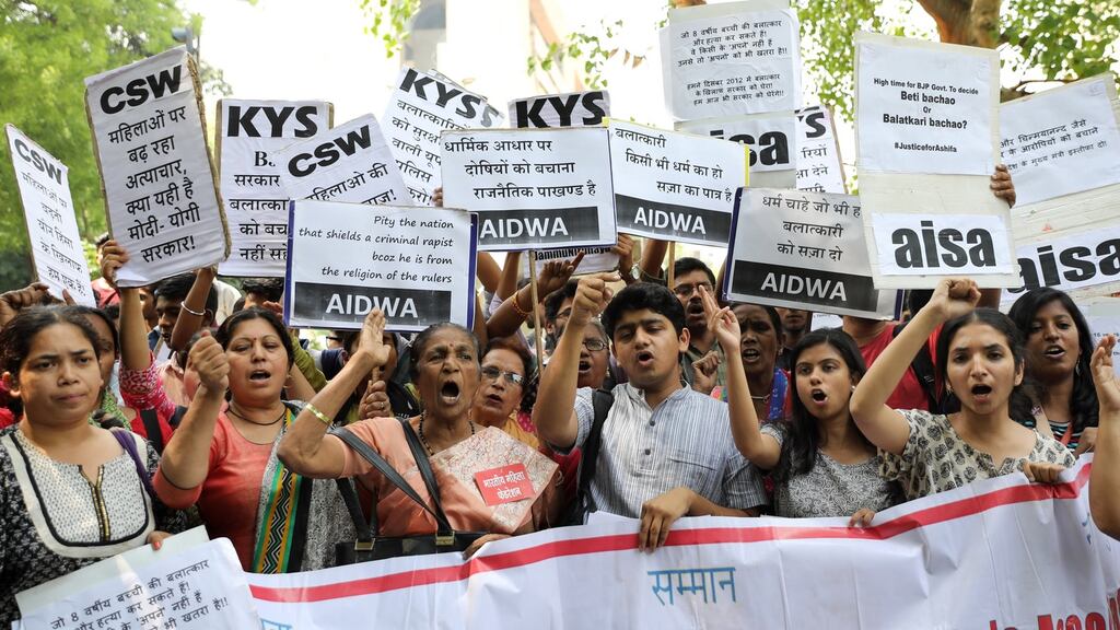 Indian activists hold placards stating ‘Indian Government take stern action against the rapists’ as they protest Bhartiya Janta Party (BJP) lawmakers allegedly defending the accused in a high profile rape case. Photograph: Rajat Gupta/EPA.