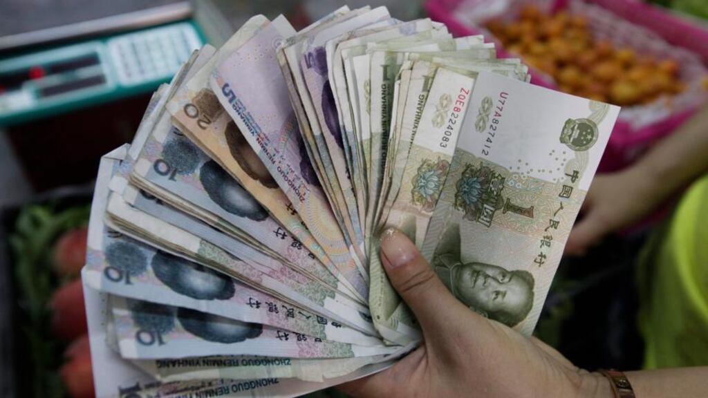 The yuan has sunk to the lowest trading price in a decade after China’s central bank devalued the currency to aid a slowing economy. Photograph: Rolex Dela Pena/EPA