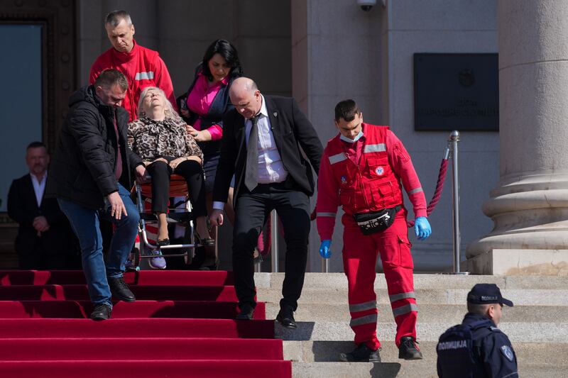 A politician is helped by medics following the incident. Photograph: Darko Vojinovic/AP