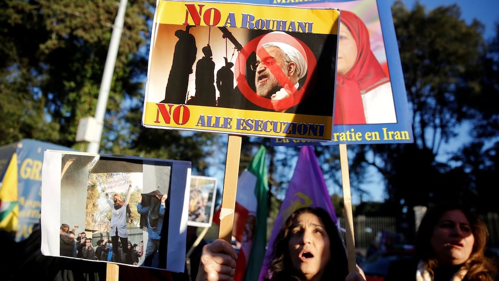 Opponents of Iranian president Hassan Rouhani hold a protest outside the Iranian embassy in Rome, Italy. Photograph: Tony Gentile/Reuters