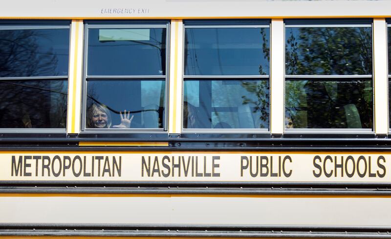 A child cries on the bus leaving the Covenant School after the mass shooting in Nashville. Photograph: Nicole Hester/The Tennessean/AP
