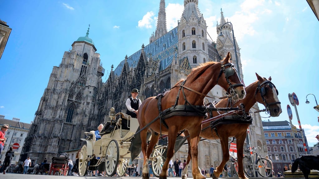 A carriage passes by the St Stephen’s cathedral in Vienna, Austria. Photograph: Joe Klamar/AFP/Getty