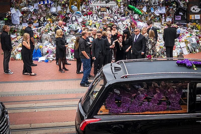 Sharon Osbourne, Jack Osbourne, Kelly Osbourne and Aimee Osbourne view tributes to the late Ozzy Osbourne from fans at Black Sabbath Bench. Photograph: Christopher Furlong/Getty Images