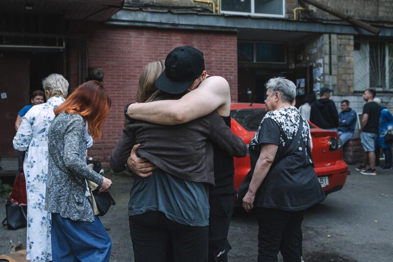 Residents console each other after a Russian air strike in Kyiv on Friday, July 4th, 2025. Russia unleashed a record air strike on Ukraine, as US president Donald Trump expressed disappointment over the outcome of a phone call with Vladimir Putin aimed at bringing an end to the war. Photograph: Andrew Kravchenko/Bloomberg