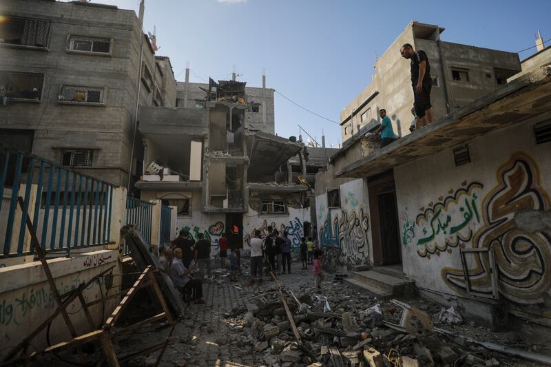 Palestinians inspect the rubble of a destroyed house following an Israeli air strike on Al- Nusairat refugee camp in the Gaza. Photograph: Mohammed Saber/EPA-EFE