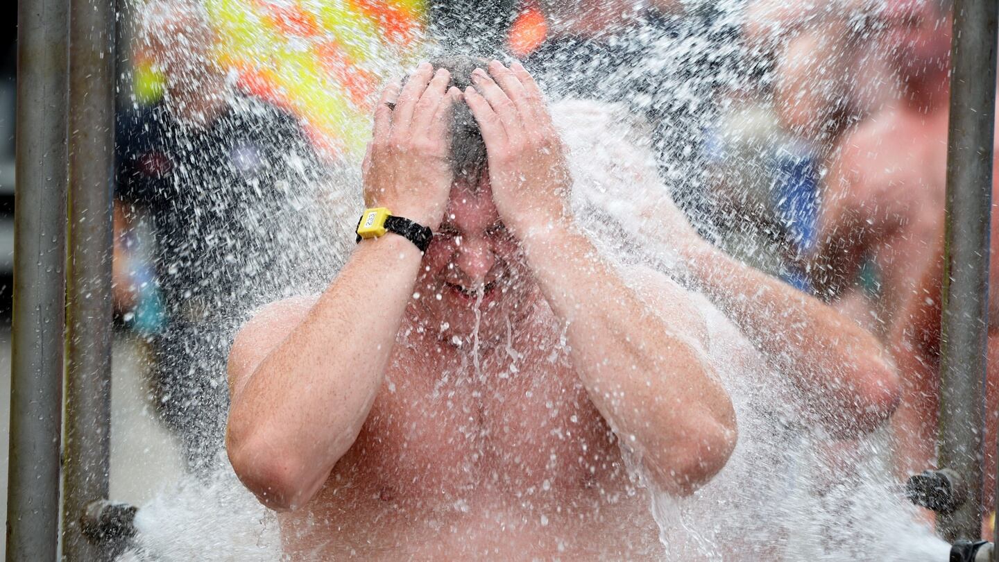 A shower after the Liffey Swim. Photograph: Dara Mac Dónaill/The Irish Times