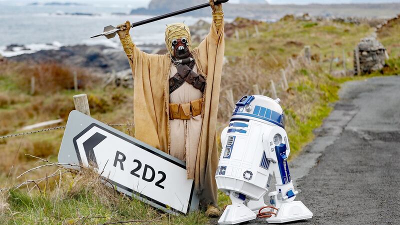 A Tusken Raider character poses with an R2D2 droid replica at the opening of the R2D2 road in Malin Head, Co Donegal on Monday. Photograph: Niall Carson/PA Wire
