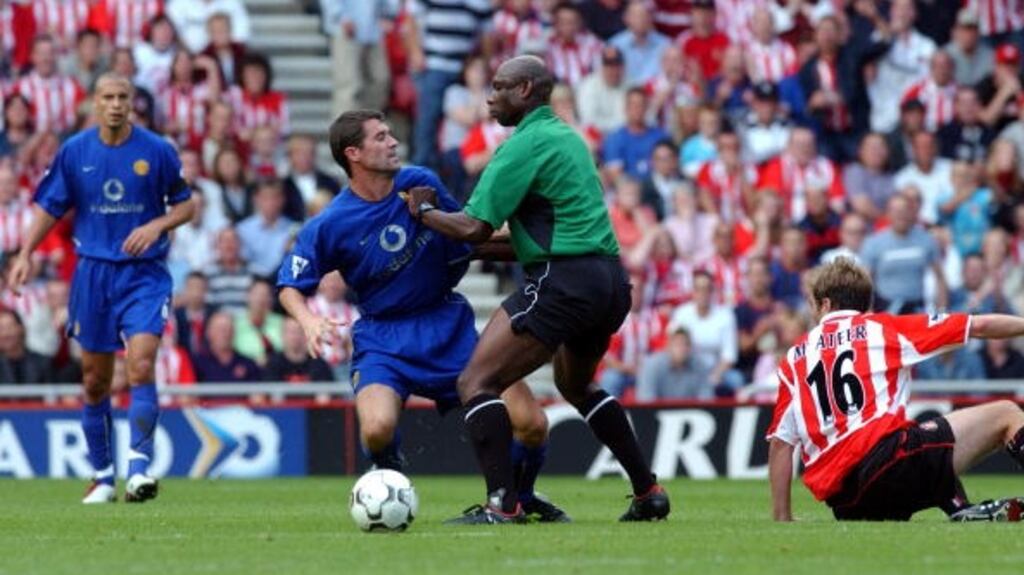Referee Uriah Rennie gets between the combatants in Round 1 of Roy Keane v Jason McAteer. Photograph: Getty Images