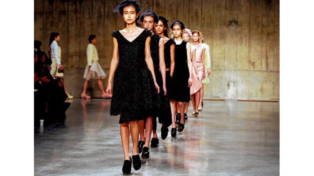 Simple dresses and princess coats in powder pink neoprene had a stiff ladylike prettiness that was offset by mannish patent brogues. photograph: getty images