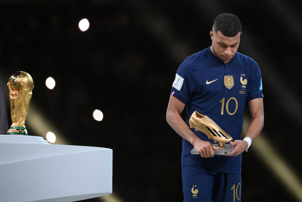 France's Kylian Mbappe with his Golden Boot award during the World Cup trophy ceremony at Lusail Stadium in Lusail, Qatar. Photograph: Franck Fife/AFP