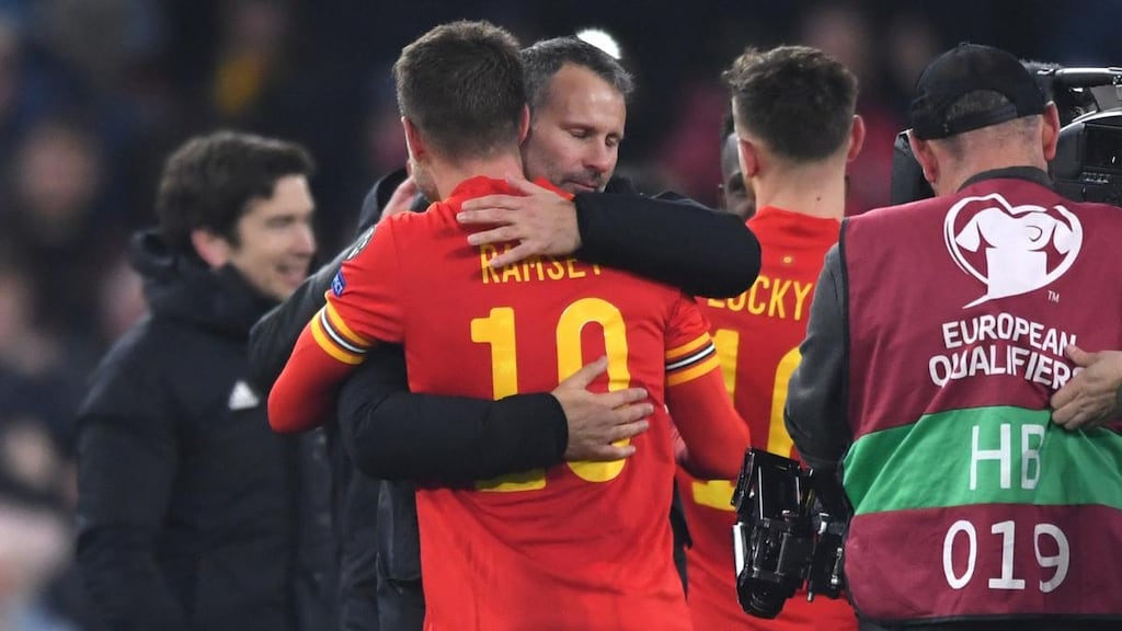Ryan Giggs celebrates with Aaron Ramsey after Wales beat Hungary 2-0. Photograph: Stu Forster/Getty