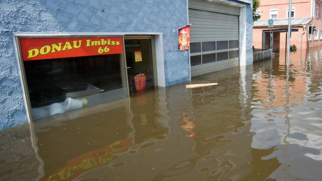 Water from the swollen Danube river flooded a diner in the suburb of Fischerdorf in Deggendorf, Germany. Eastern and southern Germany are suffering under floods that in some cases are the worst in 400 years. Photograph: Joerg Koch/Getty Images