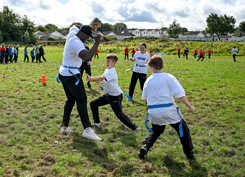 Efe Obada playing flag football with pupils from Kingswood Community College in Dublin. Photograph: Brendan Moran/Sportsfile