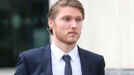 Footballer is accused of attacking sports coach