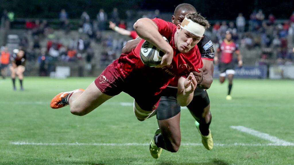 Munster’s Dan Goggin scores a try at Outeniqua Park despite the efforts of Michael Makase of the Southern Kings. Photograph: Dan Sheridan/Inpho
