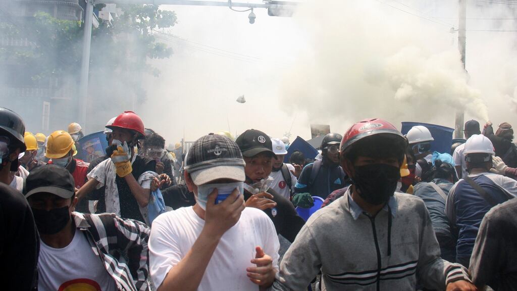 Protesters run away from tear gas launched by security forces during an anti-coup protest in Mandalay, Myanmar, Tuesday, March 2nd, 2021. Photograph: AP Photo