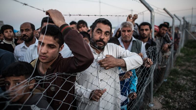 Life as a refugee: Iraqi men at a camp near Mosul. Photograph: Carl Court/Getty
