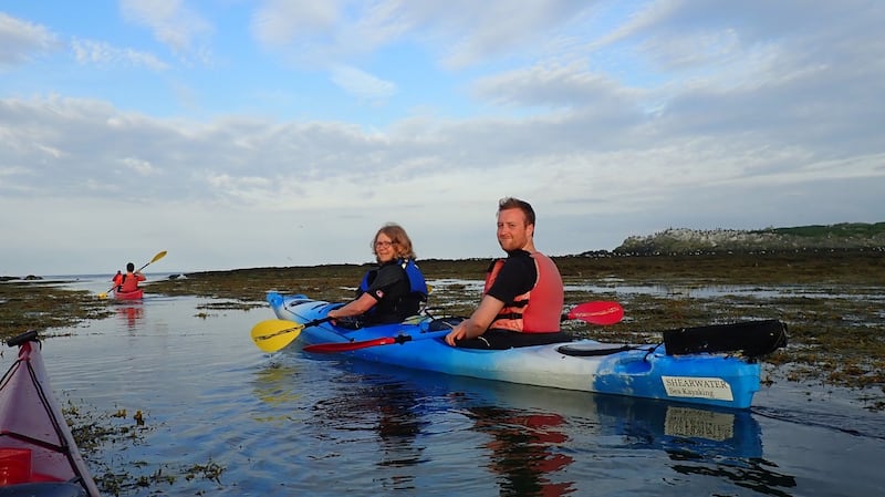 Sylvia Thompson and Thomas McIlwaine kayaking around Ireland’s Eye.